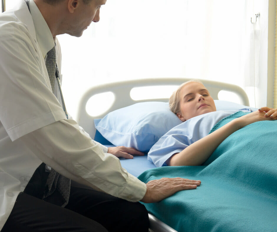 A medical professional monitoring a patient during an inpatient alcohol detox
